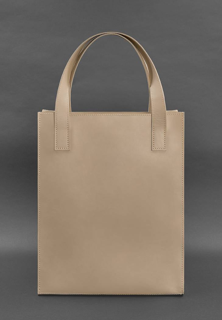Chic leather tote bag for women in beige color, perfect for everyday use.