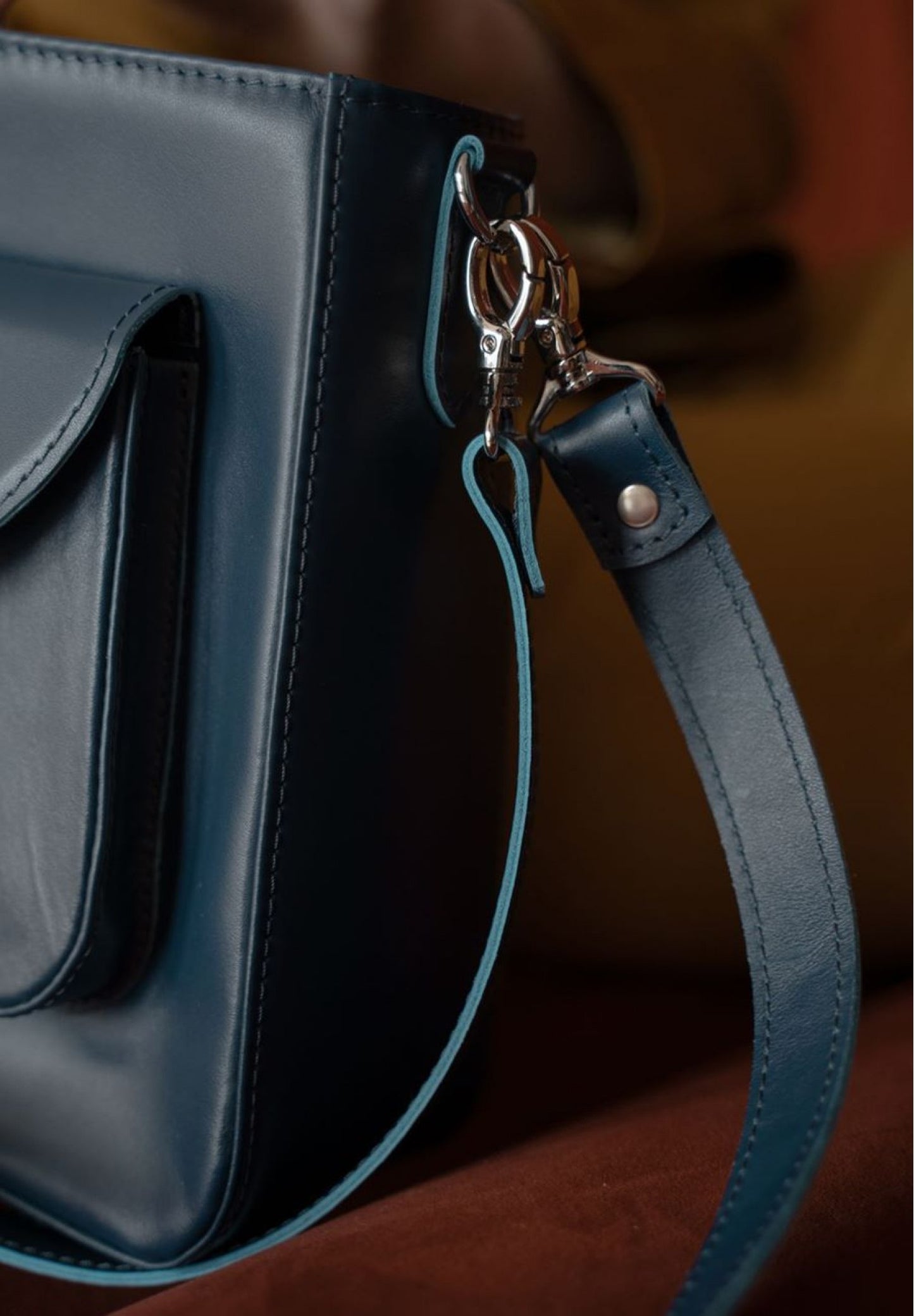 a high quality leather bag for women in navy blue color