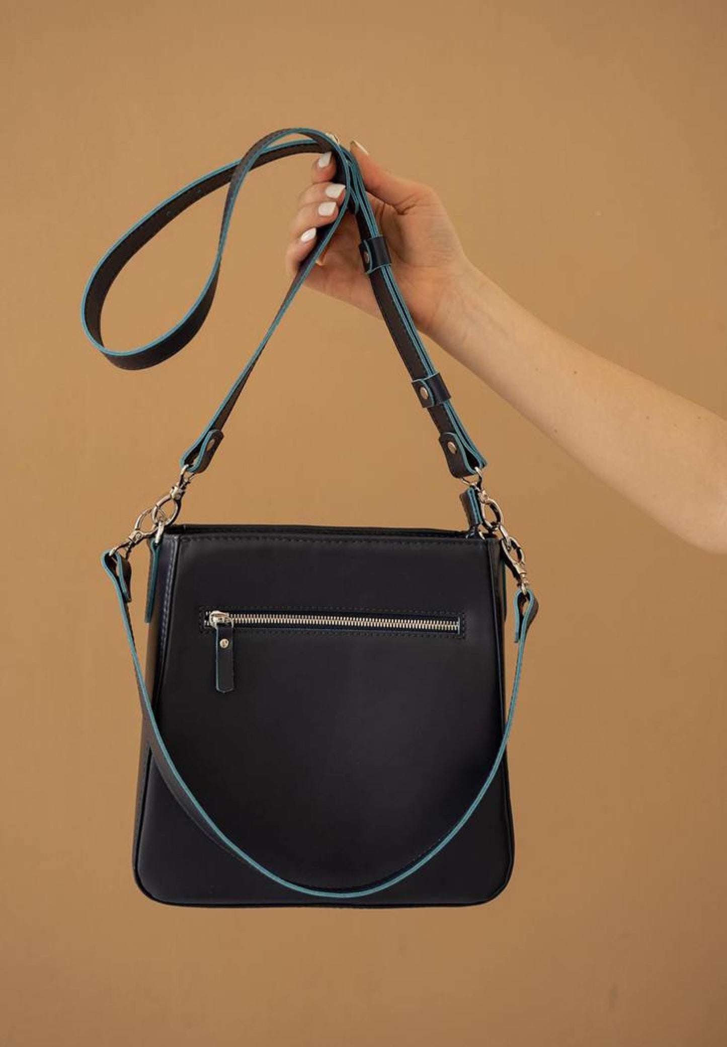 a high quality leather bag for women in navy blue color