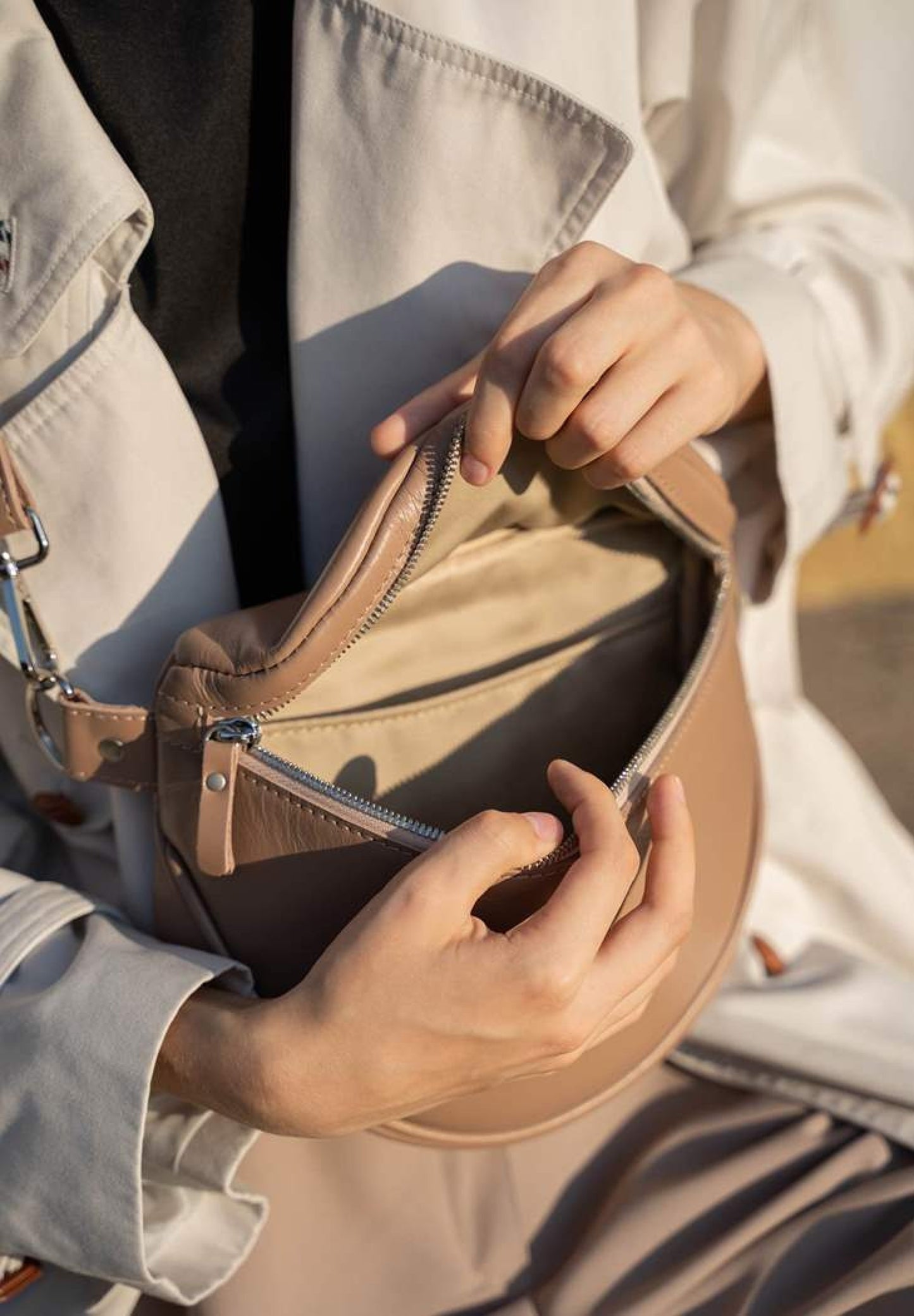 A woman is wearing caramel, nude leather crossbody bag, leather shoulder bag for women, leather shoulder bag for work, Single strap shoulder bag, Leather satchel bag, Minimalist leather shoulder bag, Genuine leather shoulder bag